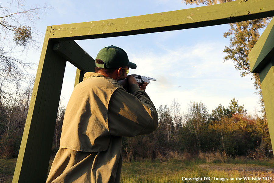 Shooter shooting at clay birdy.