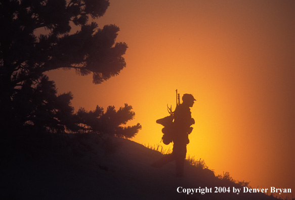 Big game hunter packing out his kill.