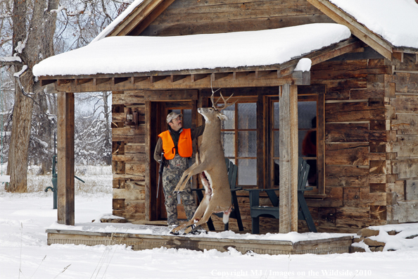 Hunter with bagged buck. 