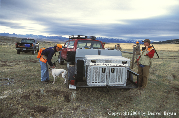 Upland bird hunters and dog getting ready.