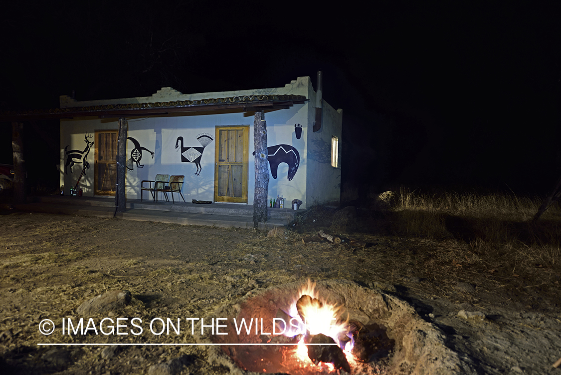 Hunter's cabin at night.