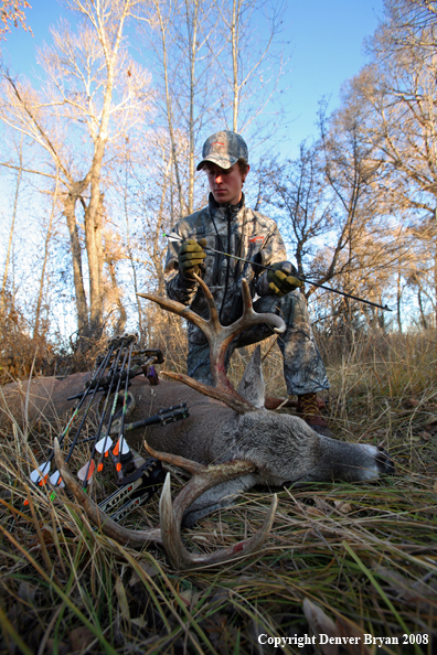 Bowhunter with Whitetail Deer