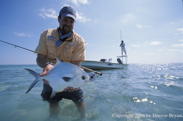 Saltwater flyfisherman holding permit.