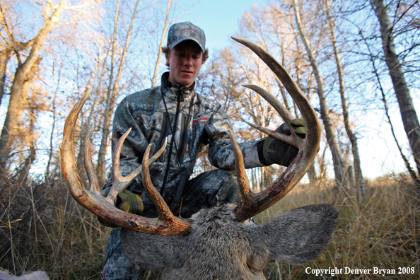 Bowhunter with Whitetail Deer
