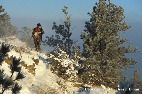 Big game hunter packing out his kill.