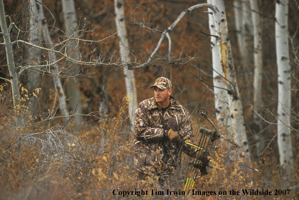 Bowhunter in woods.
