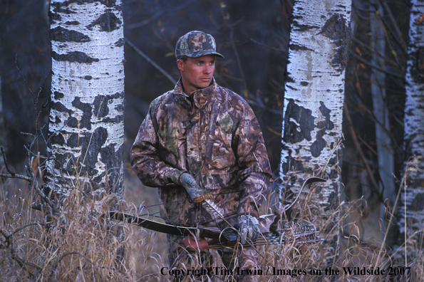 Bowhunter in woods.