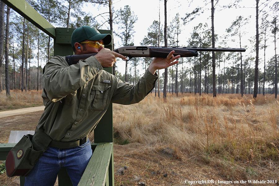 Shooter at sporting clay course. 