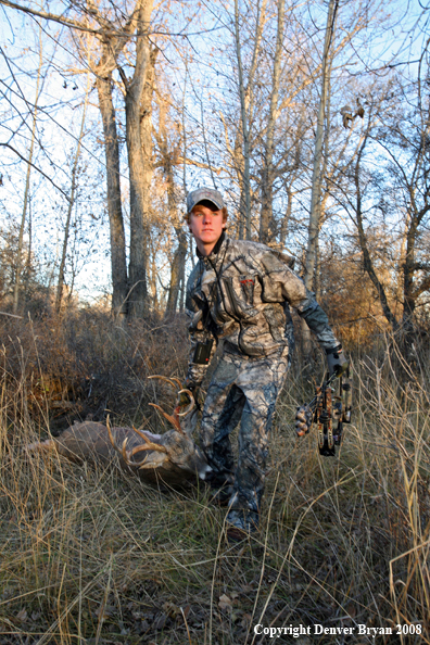 Bowhunter with Whitetail Deer