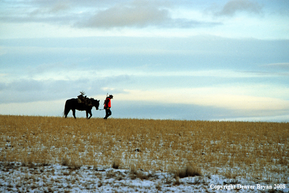 Hunter with Whitetail Deer
