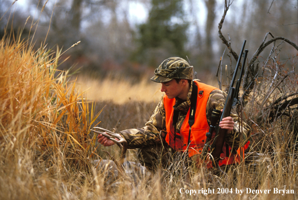 Hunter with bagged white-tailed deer.