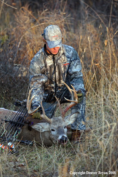 Bowhunter with Whitetail Deer
