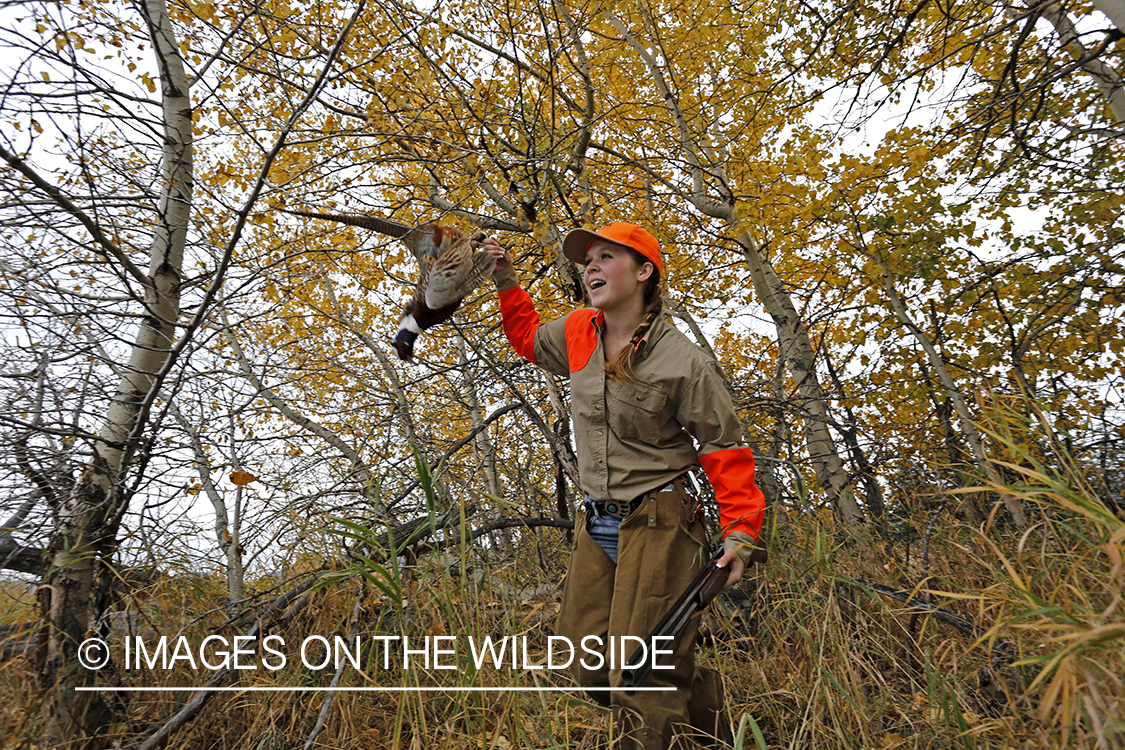 Woman with bagged pheasant.