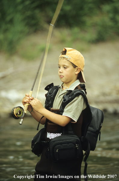 Young boy flyfishing