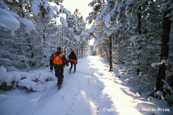 Big game hunters tracking game.