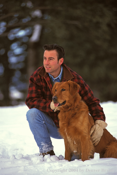 Man with golden Retriever.
