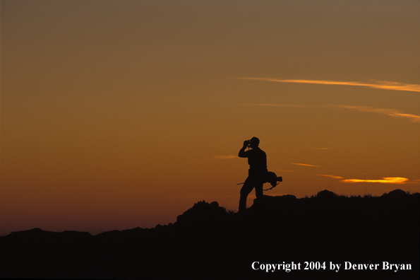 Big game hunter glassing.