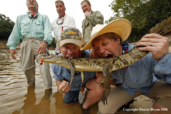Flyfisherman eating caiman