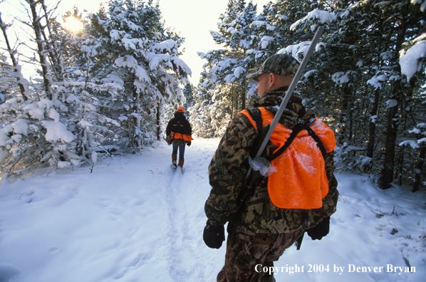 Big game hunters tracking game.