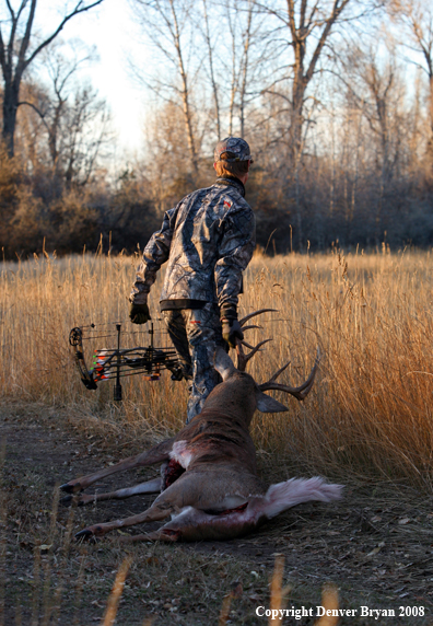 Bowhunter with Whitetail Deer
