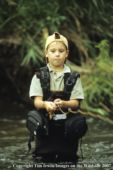 Young boy flyfishing