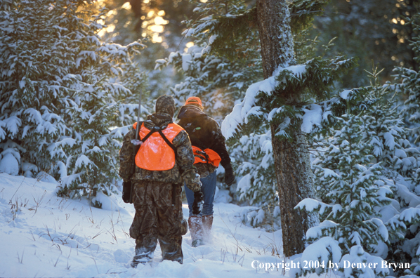 Big game hunters tracking game.
