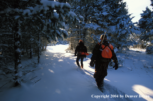 Big game hunters tracking game.