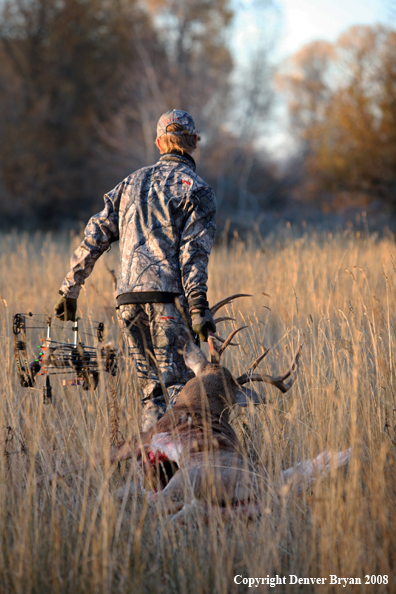 Bowhunter with Whitetail Deer