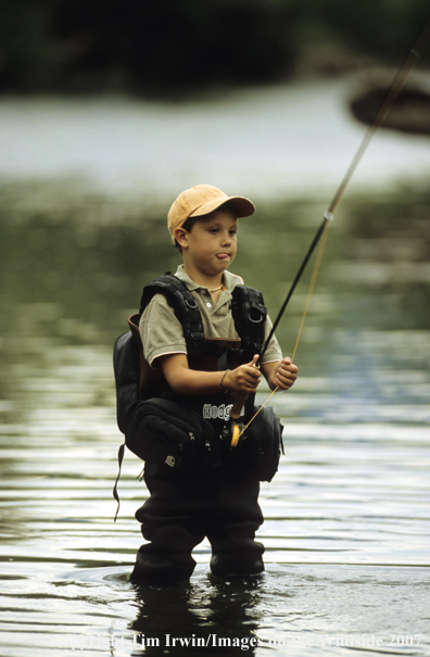 Young boy flyfishing