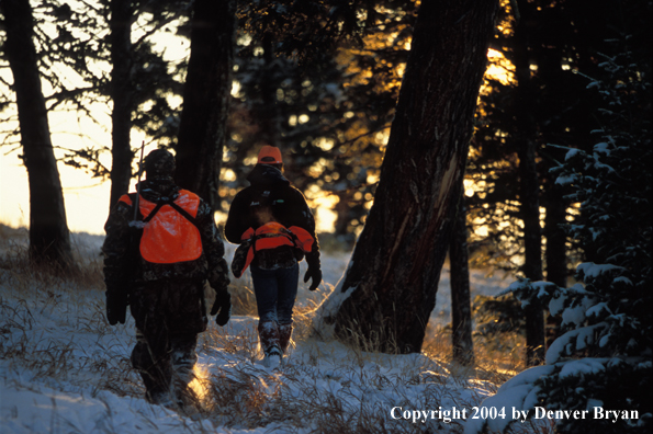 Big game hunters tracking game.