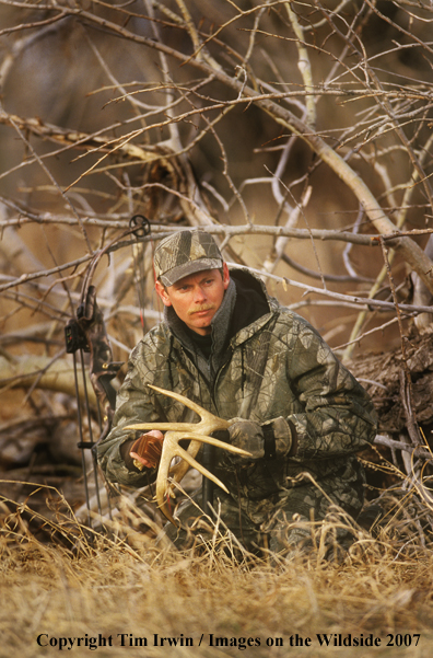 Bowhunter in field.