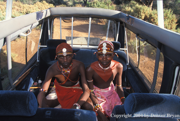 Samburu tribesmen in safari vehicle.  Kenya, Africa