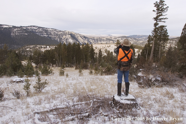 Big game hunter glassing for game.
