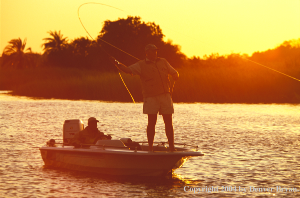 Flyfisherman casting from boat.