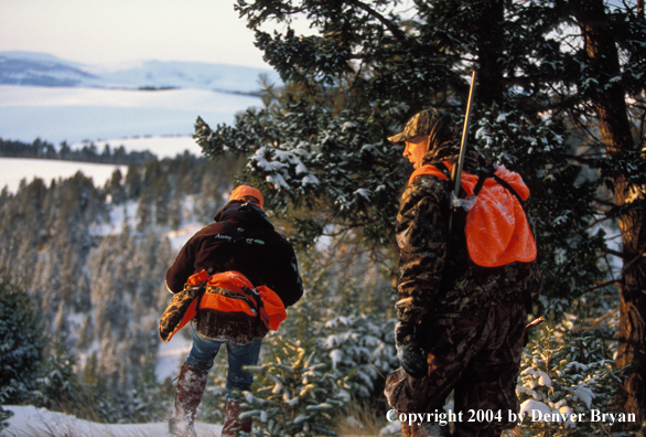 Big game hunters tracking game.