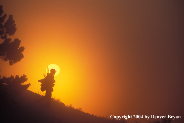 Big game hunter packing out his kill.