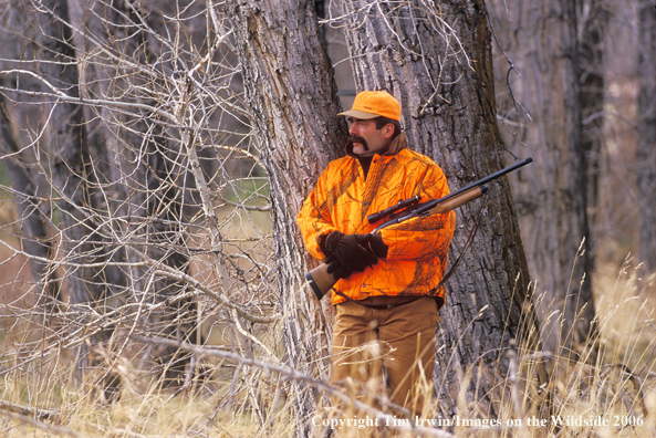 Big game hunter in field.  