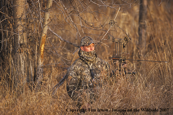 Bowhunter in field.