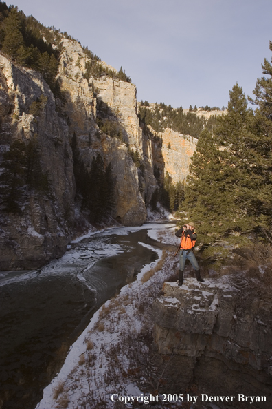 Big game hunter glassing for game.