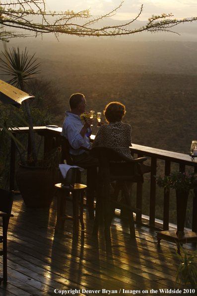 Couple watching sunset on safari