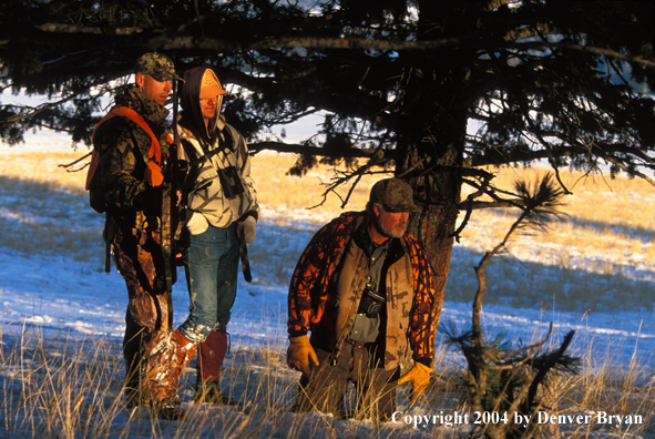 Big game hunters tracking game.