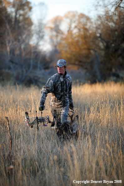 Bowhunter with Whitetail Deer
