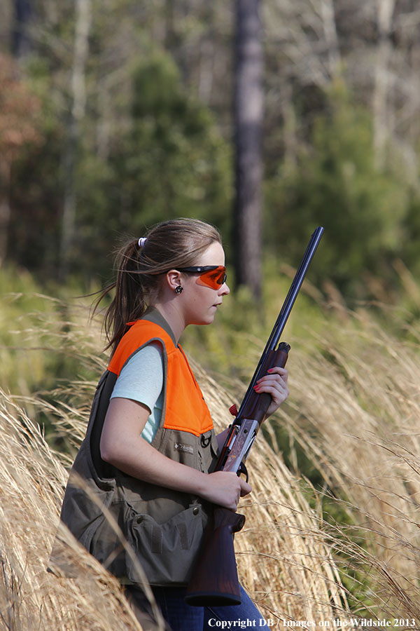 Young hunter in field.