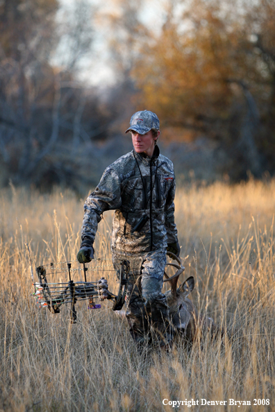 Bowhunter with Whitetail Deer