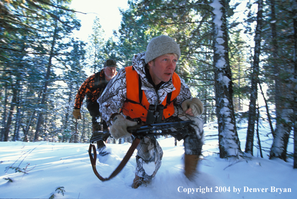 Big game hunters tracking game.