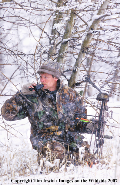 Bowhunter glassing in winter.