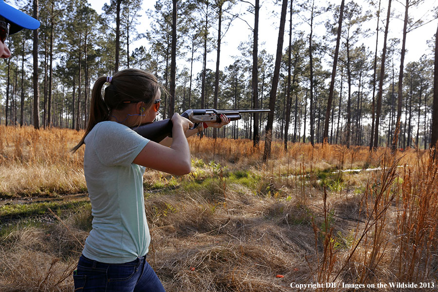 Young hunter in field.