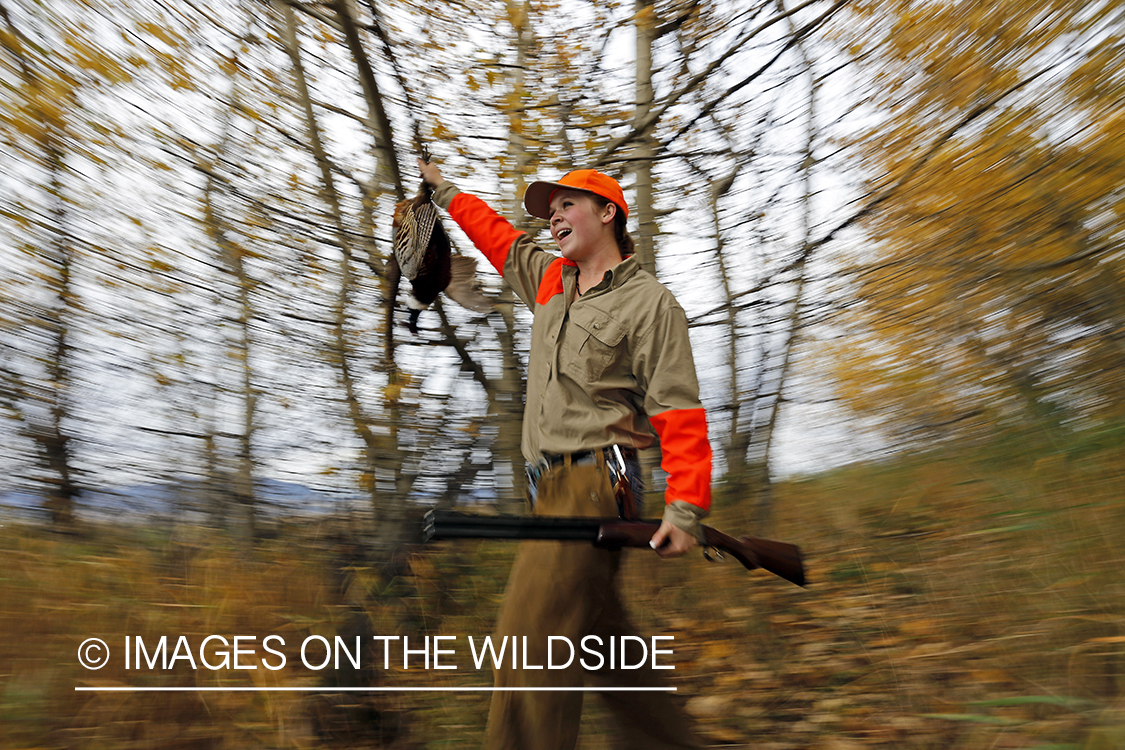 Woman with bagged pheasant.