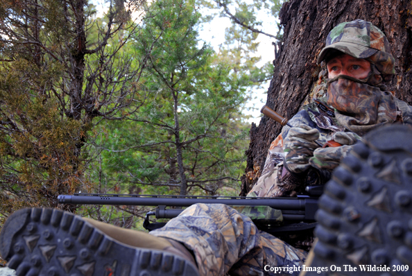 Hunter with turkey call.