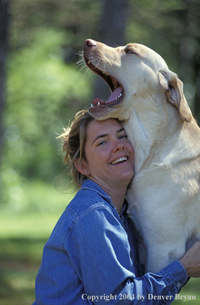 Woman with yellow Labrador Retriever